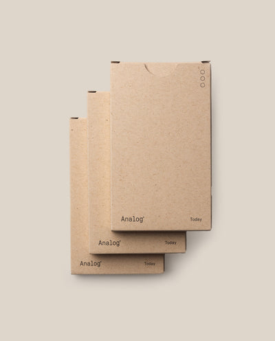 Three overlapping kraft paper boxes labeled “Analog” and “Today”—the Analog - Today Cards (3-Pack)—sit on a beige background. Designed for 3x5 Index Cards, the minimalist boxes feature small circular icons on the top right corner.