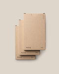 Three stacked brown cardboard boxes of the Analog - Today Cards (3-Pack) sit against a plain beige background, with “Analog” and “Today” on the lower corners and minimalist circle details in the upper right.