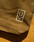 Olive green heavyweight cotton Ugmonk Utility Tote (Olive) featuring a white rectangular logo with a U inside.