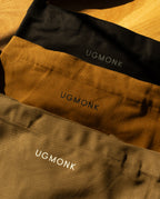 Utility Tote Bundle - Set of 3 featuring three heavyweight cotton tote bags in black, tan, and olive, each with the brand name printed on the front.