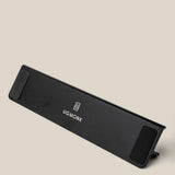 A black, rectangular wrist rest featuring the Ugmonk logo and name in white, displayed on a neutral beige background—perfect to pair with your Analog Annual Kit (Black Aluminum).