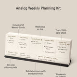 The Analog Weekly Planning Kit (Black Aluminum) includes 52 weekly cards on thick 100lb cardstock and a sleek aluminum stand with non-slip pads. Weekdays appear on top, weekends on bottom. Dimensions: 8.5” x 1.9” x 3”.