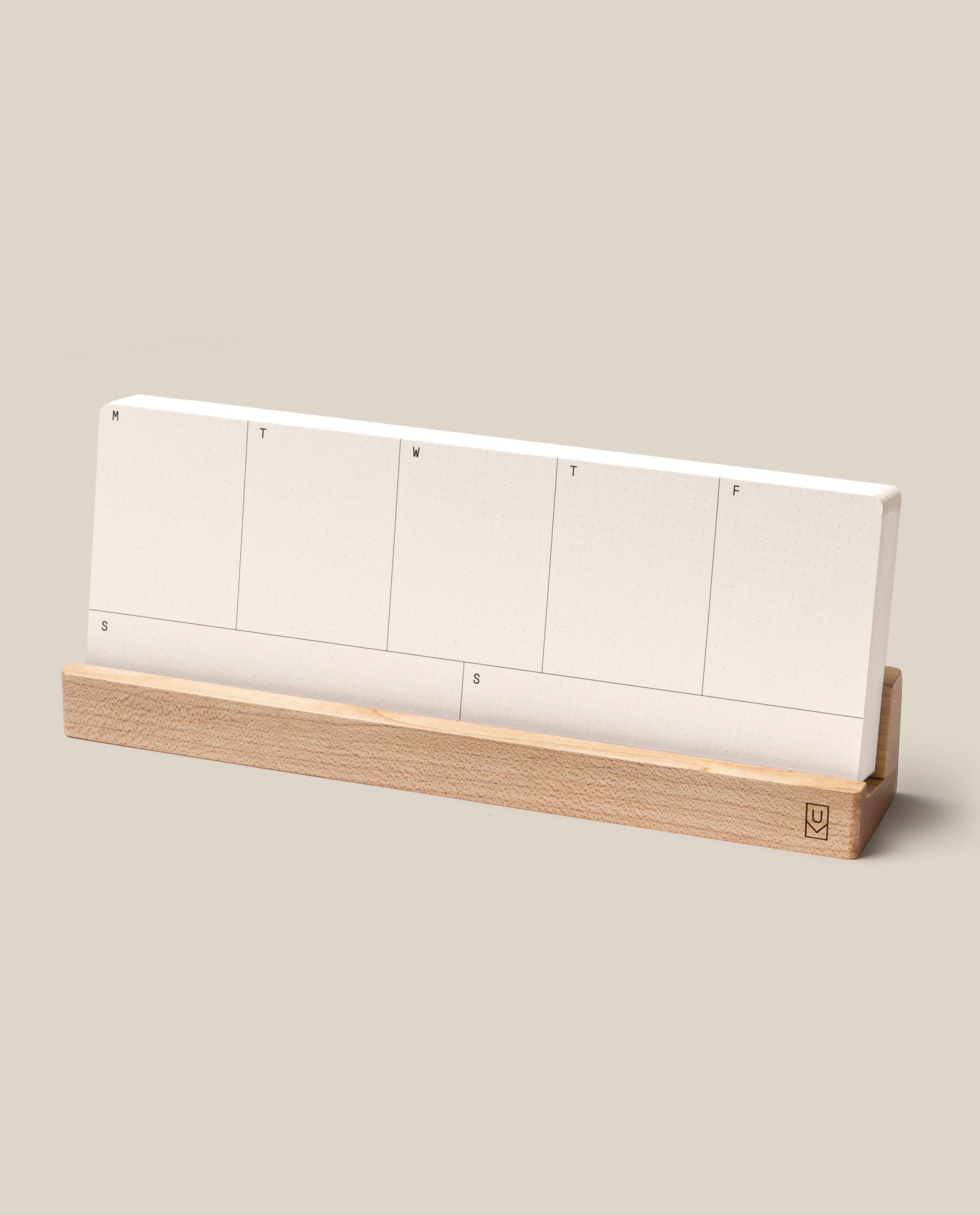 The Analog Weekly Planning Kit (Maple) features white planner cards labeled for each day, neatly arranged in a light maple holder, perfect for minimalist weekly organization.