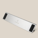 A silver Aluminum Card Stand with black non-slip pads and a central Ugmonk logo is displayed on a plain beige background. Complements your Analog Weekly Planning Kit (Silver Aluminum) perfectly for stylish organization.