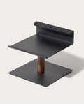 The Gather Laptop Stand (Black/Walnut) is a modern, minimalist ergonomic stand with a flat base, vertical walnut support, and raised platform with felt-lined edge for secure device holding—expertly made in the USA.