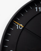 A close-up of the Braun Wall Clock (Black), celebrated for its minimalist design and easy-to-read clock face.