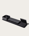 The Gather 1x4 Organizer Set (Black) is a sleek, modular desk organizer made in Pennsylvania with powder-coated steel compartments, a central grooved tray, left-side bin, and felt-lined angled sections on a rectangular base.