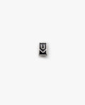 The Ugmonk Enamel Pin is a small, rectangular metallic accessory featuring a minimalist design with geometric U and M shapes on a plain white background.