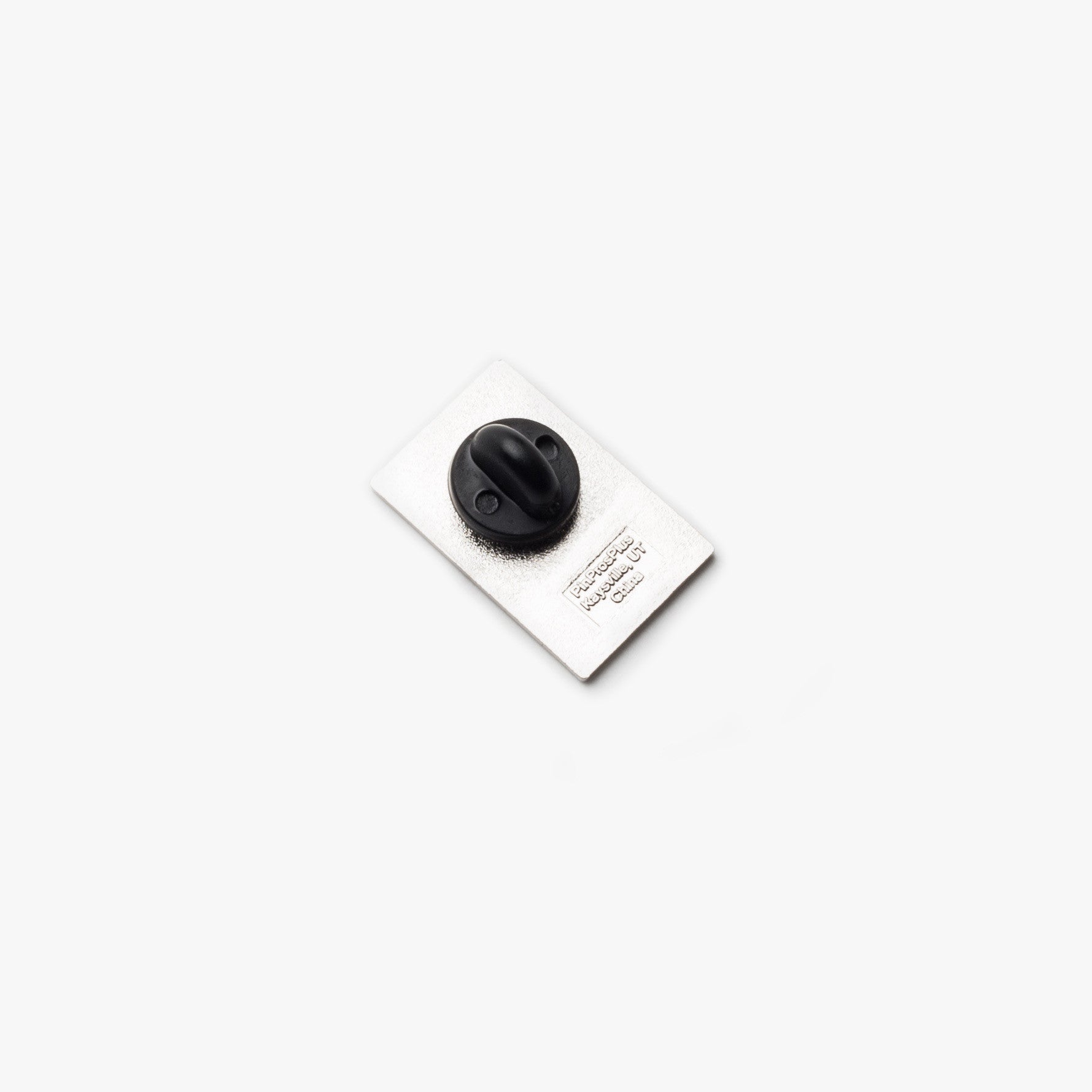 A Ugmonk Enamel Pin with a rectangular shape and black rubber clutch backing is centered on a plain white background.
